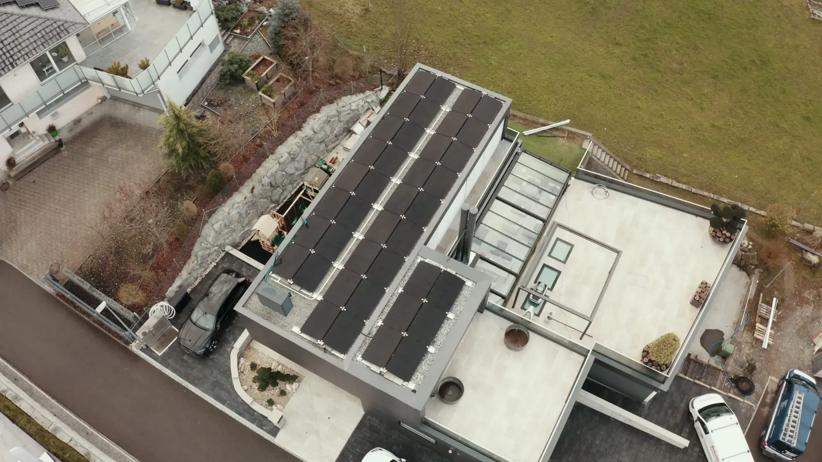 Drone flight over the new building in Benken with a solar system on the flat roof.